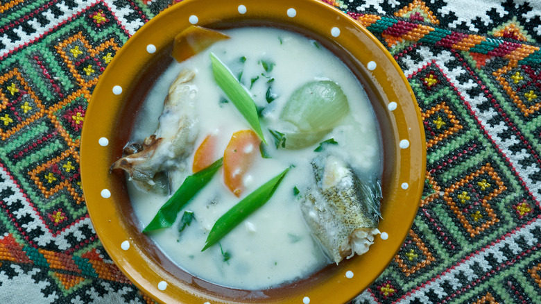 White broth in brown bowl