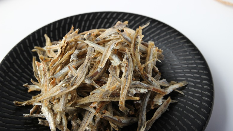 Dried anchovies on table