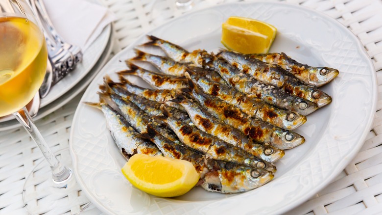 Grilled sardines on plate