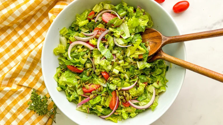 everyday salad with wooden spoons