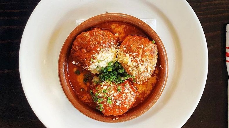 three meatballs red sauce dish