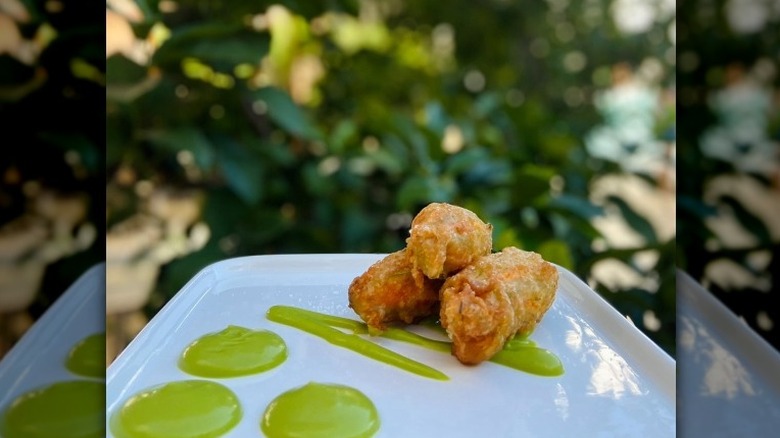 Fritters with green sauce