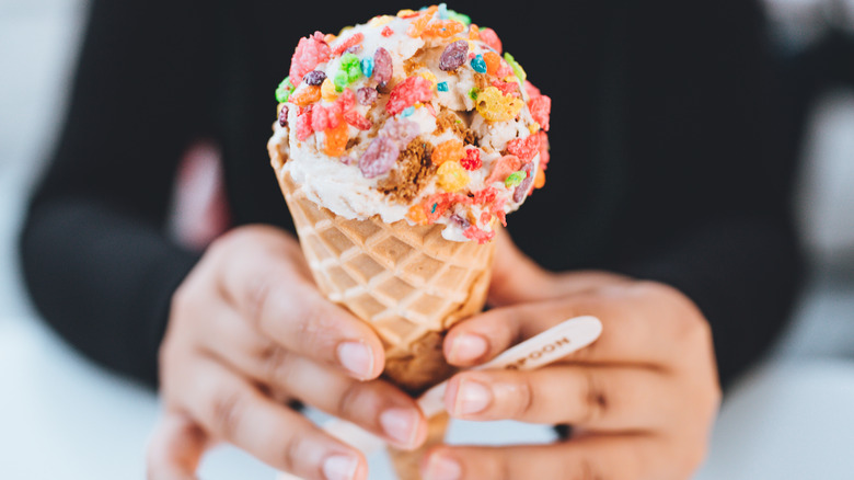 Fruity cereal on ice cream cone