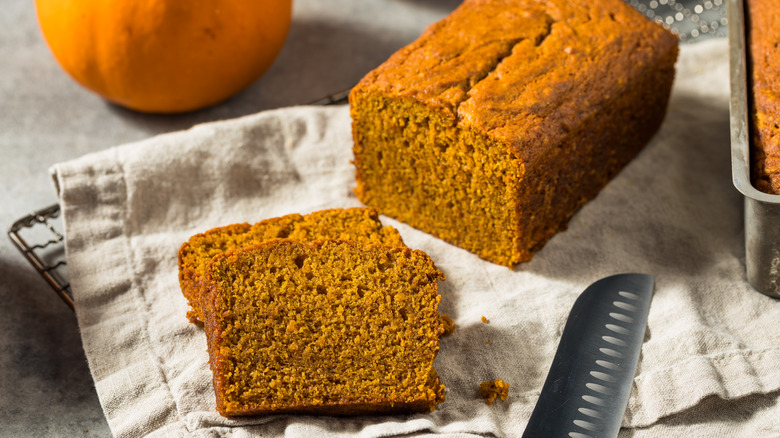 Pumpkin bread sliced on a cooling rack