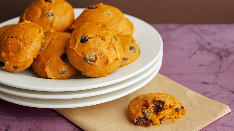 Plate of pumpkin cookies with one half eaten