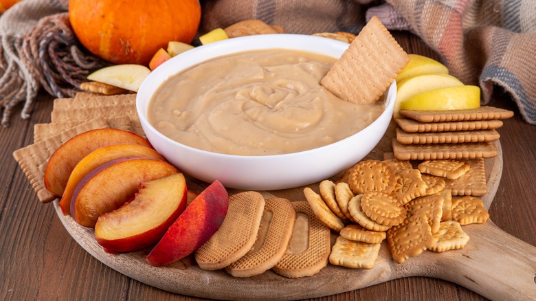 Bowl of pumpkin dip with various dippers