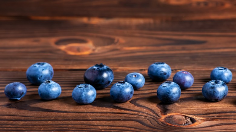 Blueberries on wooden surface