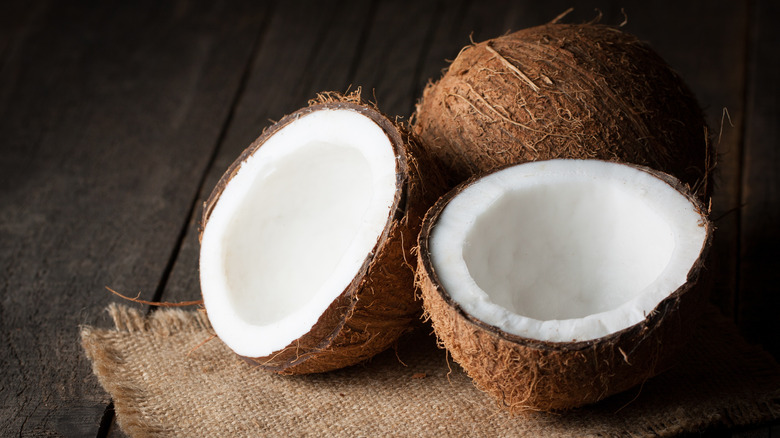 Coconuts on wooden surface