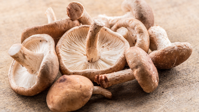 Shiitake mushrooms on wooden surface