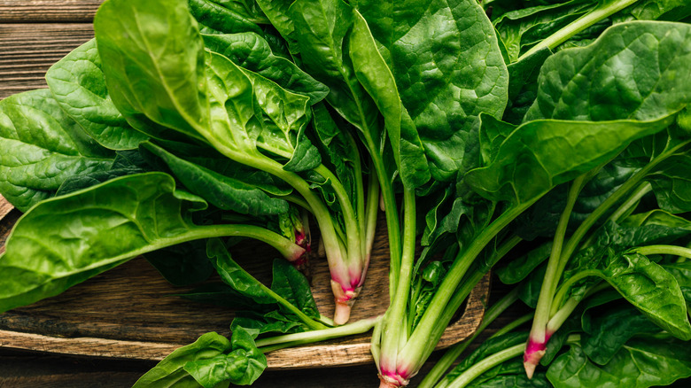 Spinach on wooden surface