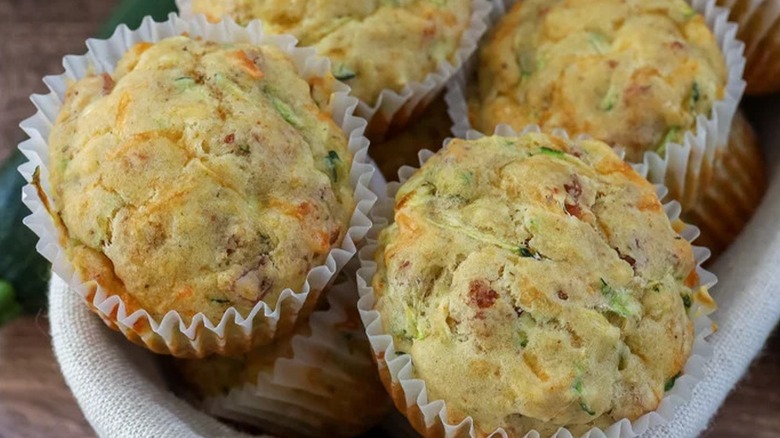 Close-up of four cheesy zucchini muffins