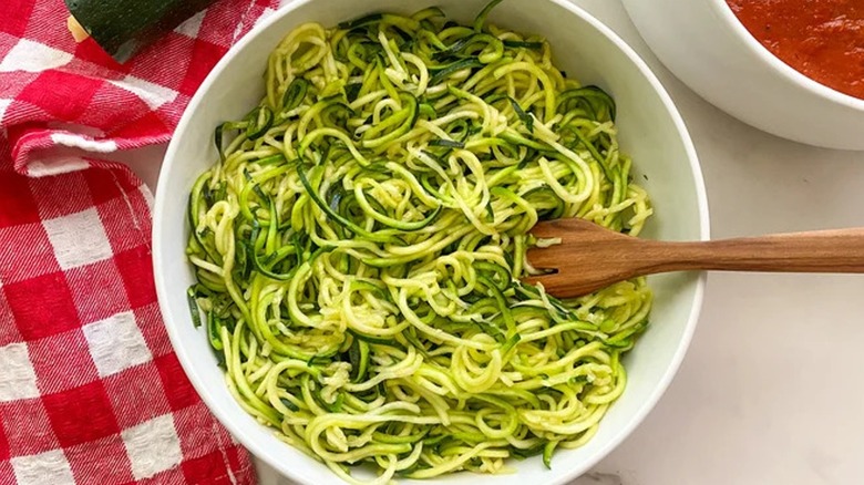 Top-down view of zucchini noodles in a bowl