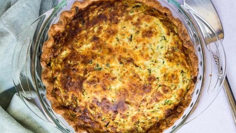 Top-down view of zucchini pie in a glass dish