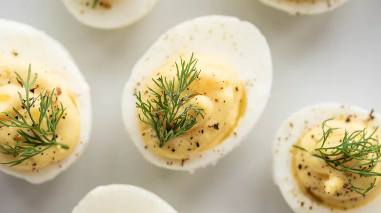 Deviled eggs with dill garnish