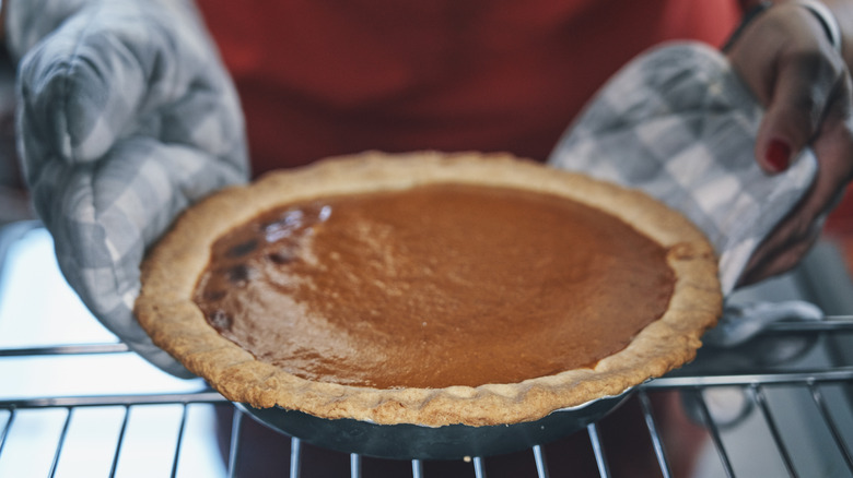 Pumpkin pie in oven