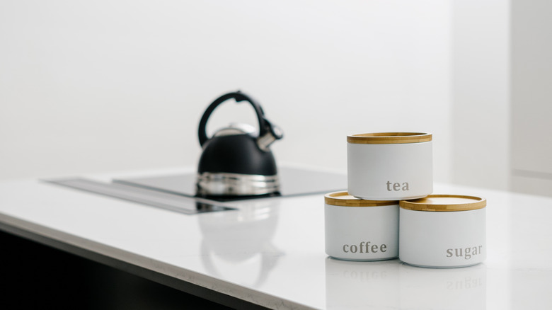 Labeled storage jars on countertop