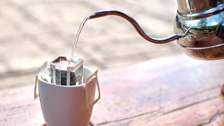 Filtered water pouring into mug