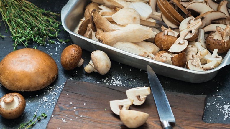 Various raw mushrooms in tray