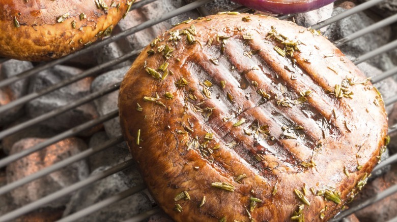 Seared portobello mushrooms on grill