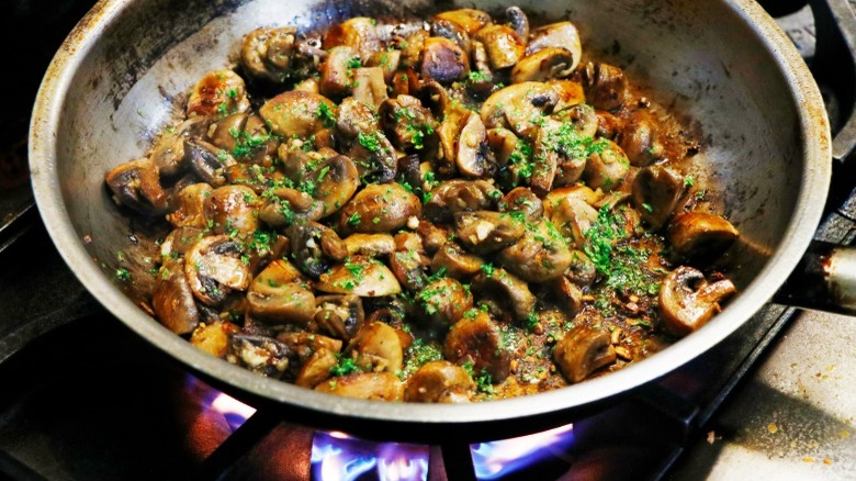 Mushroom sauté over gas stove