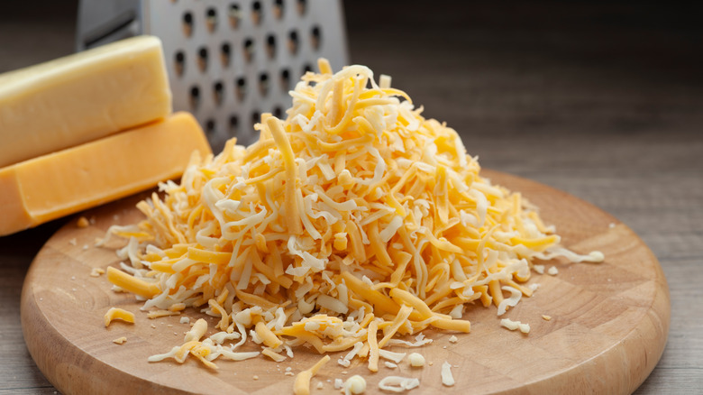 pile of shredded cheddar cheese