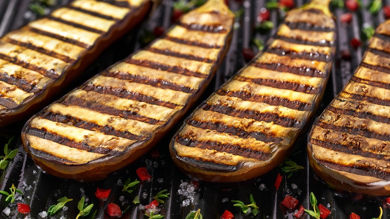 sliced eggplants on grill