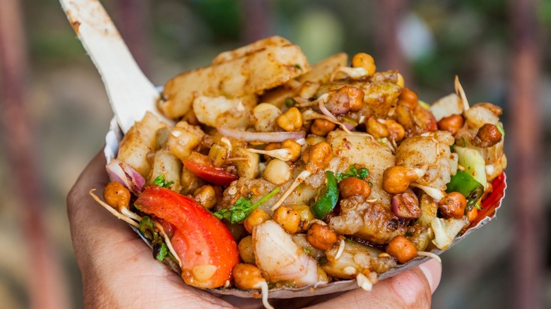 Man holding chana chaat