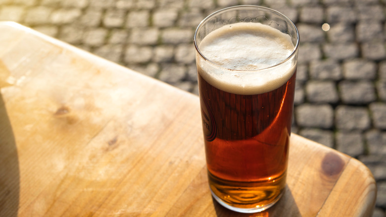 Altbier on a table with cobblestone streets