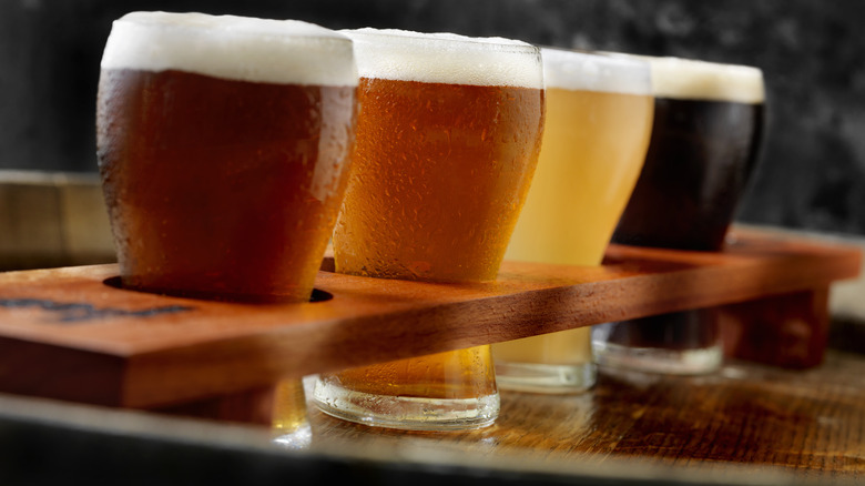 Craft beer sampler tray with different colored beers