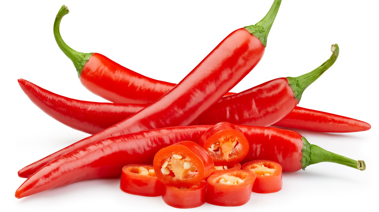 Cayenne peppers on white background