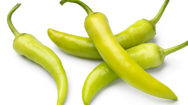 Wax peppers on white background