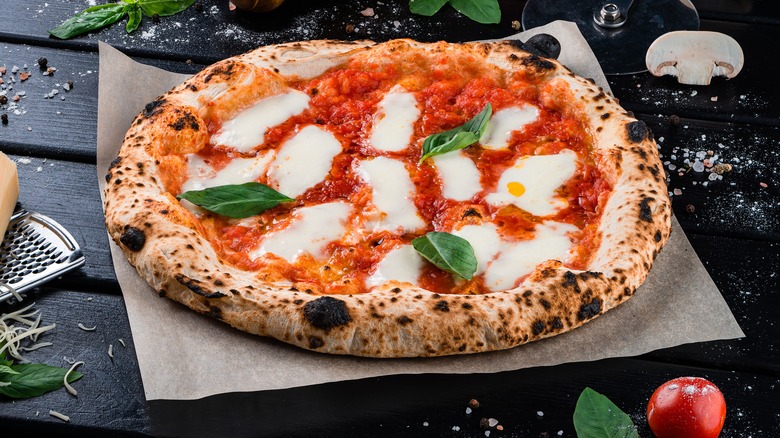 Neapolitan pizza with mozarella basil