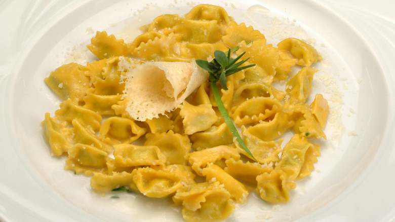 agnolotti del plin with buter on plate