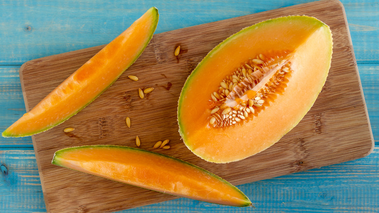 Cut cantaloupe on wood board