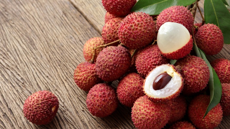 Lychees on wood background