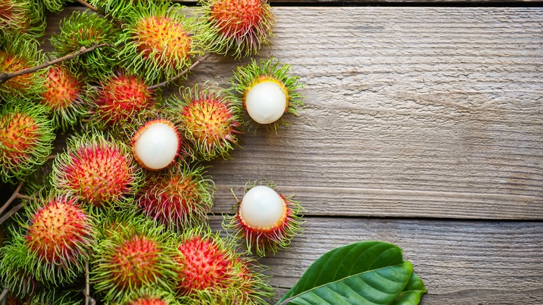 Rambutans on wood background