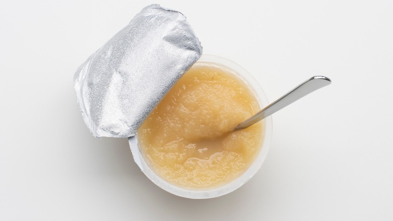 open applesauce cup with spoon