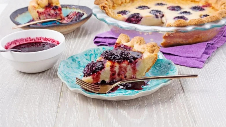 Slice of blackberry-buttermilk pie on table
