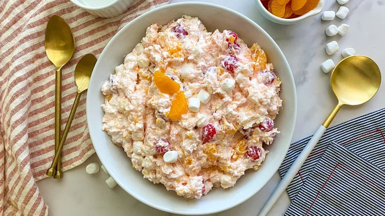 Ambrosia salad in a bowl with tableware