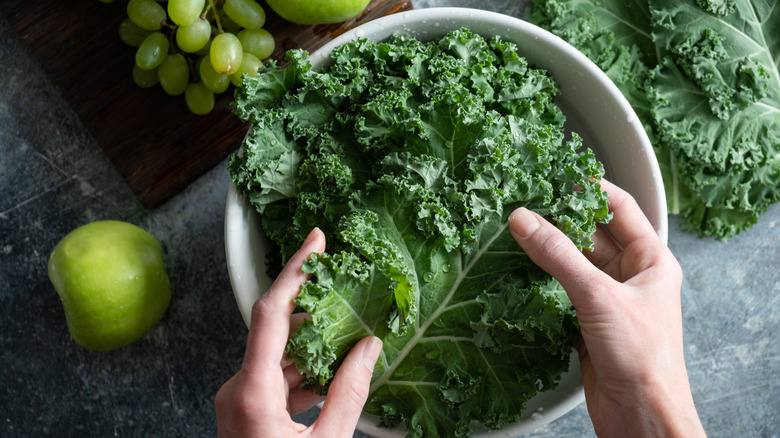 washing kale in bowl