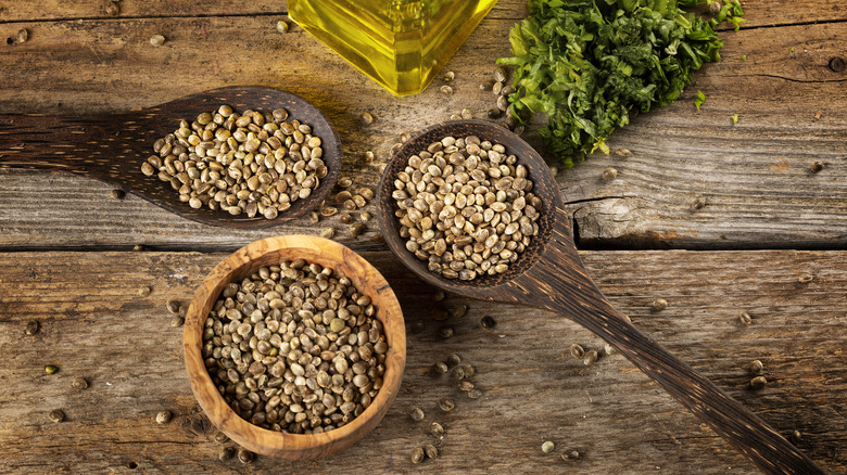 Hemp seeds on wooden background