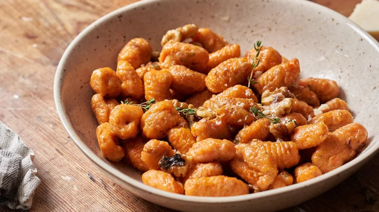 Carrot gnocchi in bowl 