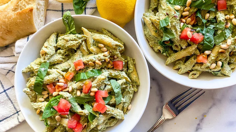 Tofu pesto pasta in bowls 