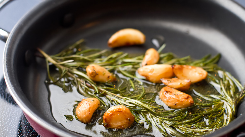 Cooking garlic and rosemary