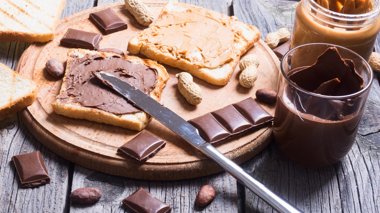 Peanut butter and chocolate spread on bread