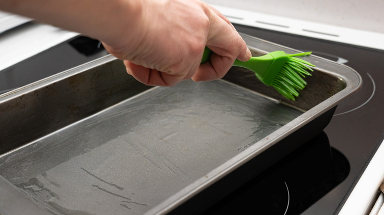 Greasing baking tray with brush