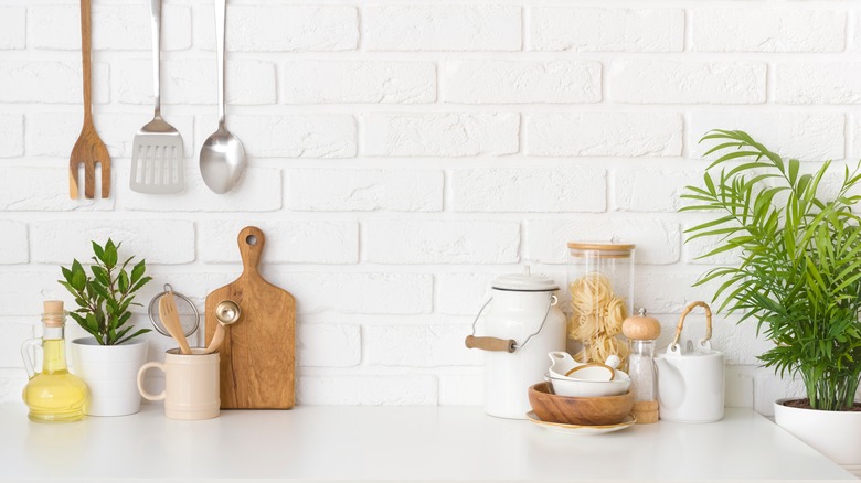 White kitchen with cooking utensils 