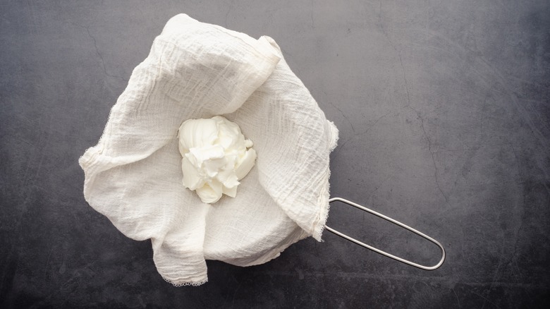 Cheesecloth with yogurt over sieve