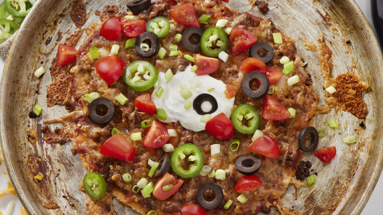 Colorful taco pizza on plate