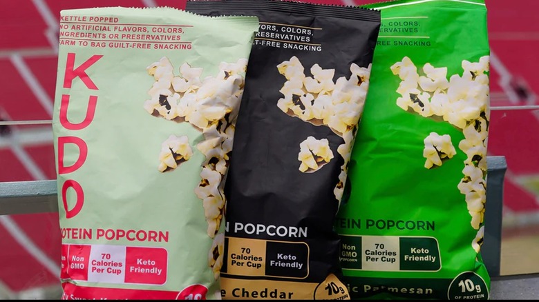 Three bags of KUDO Protein Popcorn
